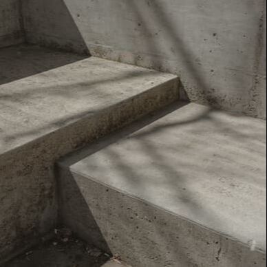 Concrete stair case made out of wet dirt. 